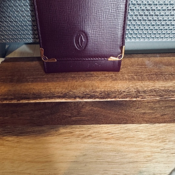 Cartier Handbags - Cartier Burgundy Wallet with Gold Accents
